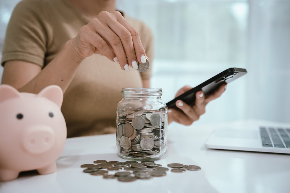 Portfolio planning and budgeting — saving and investing smart with coins and piggy bank